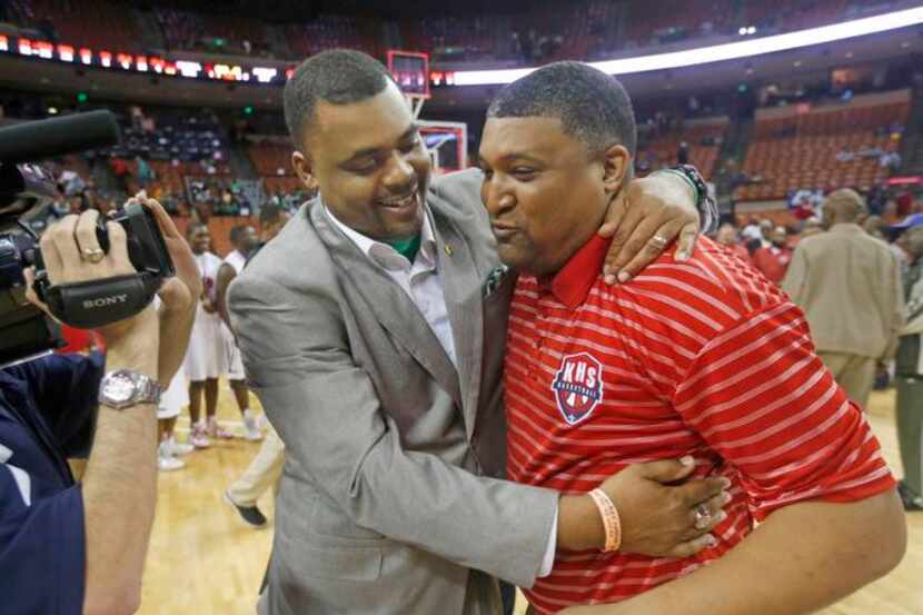 
Madison coach Roderick Johnson (left) congratulated his brother, Kimball coach Royce...