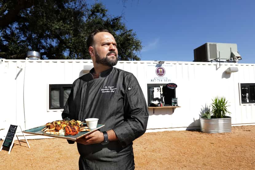 Dimitrios Vagenas poses for a photograph at his Greek food popup My Kuzina in Grand Prairie