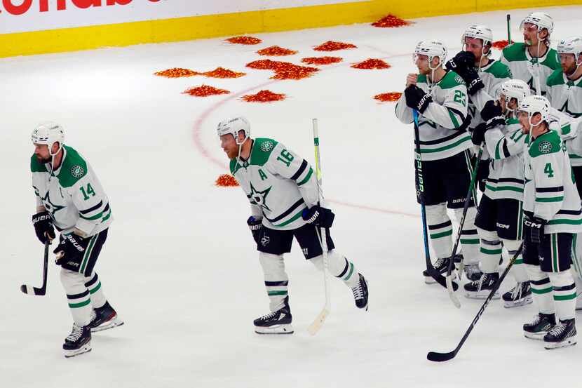 Dallas Stars center Joe Pavelski (16) follows left wing Jamie Benn (14) to start the...