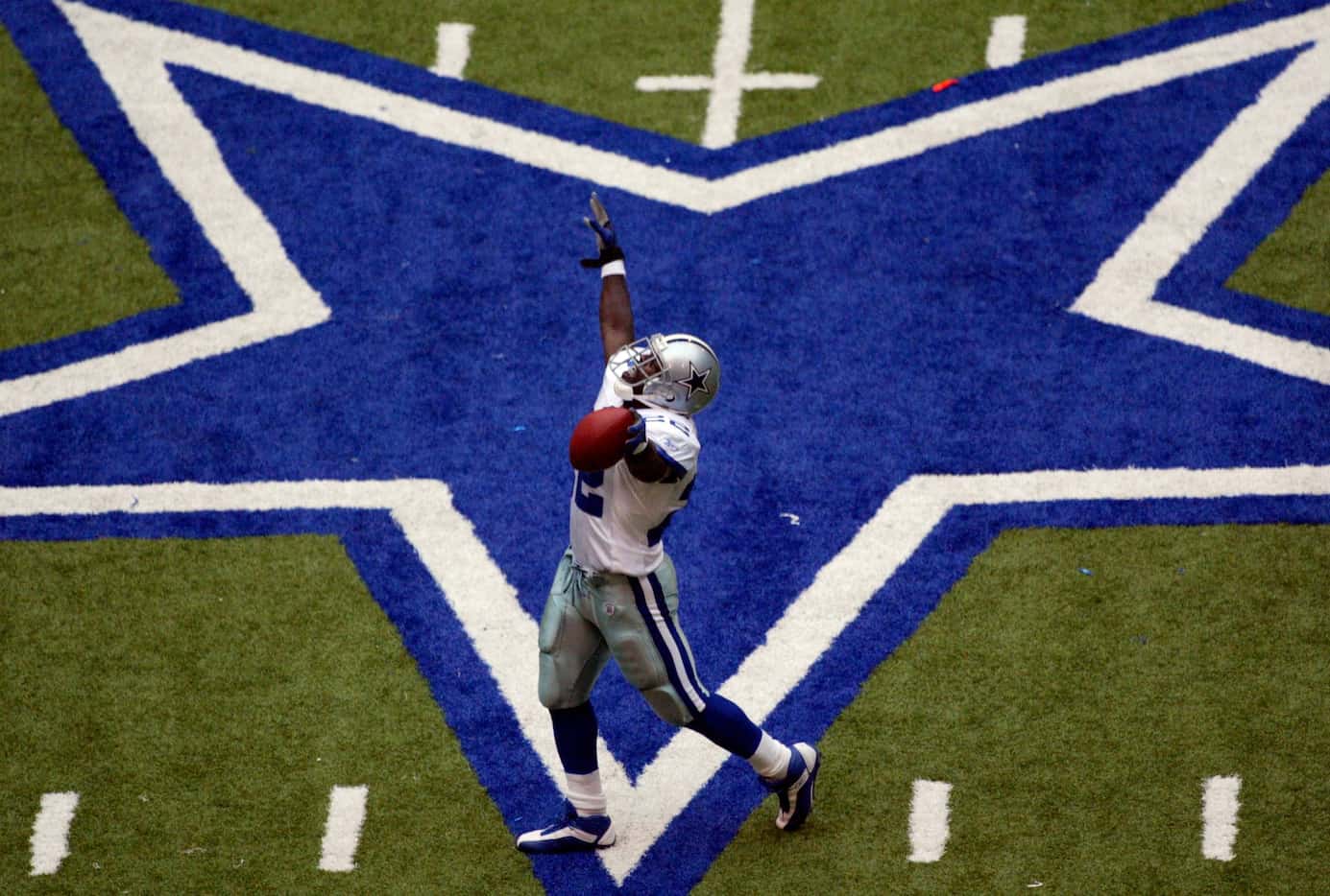 Dallas Cowboys running back Emmitt Smith celebrates setting the all-time career rushing...