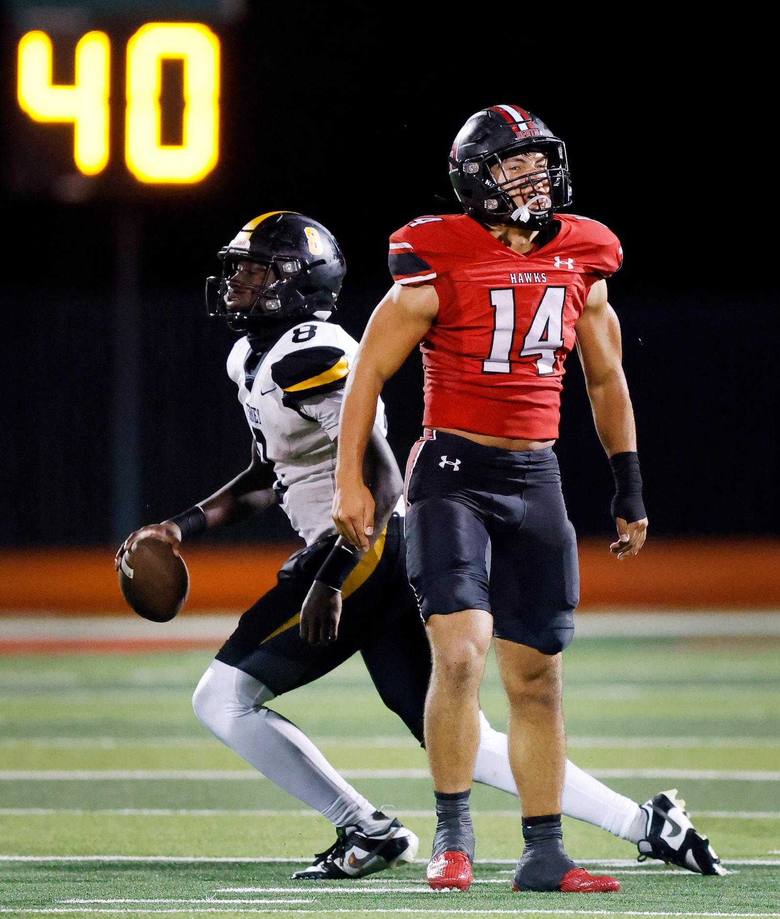 Rockwall-Heath linebacker Zeke Cannon (14) reacts after sacking Forney quarterback Nelson...