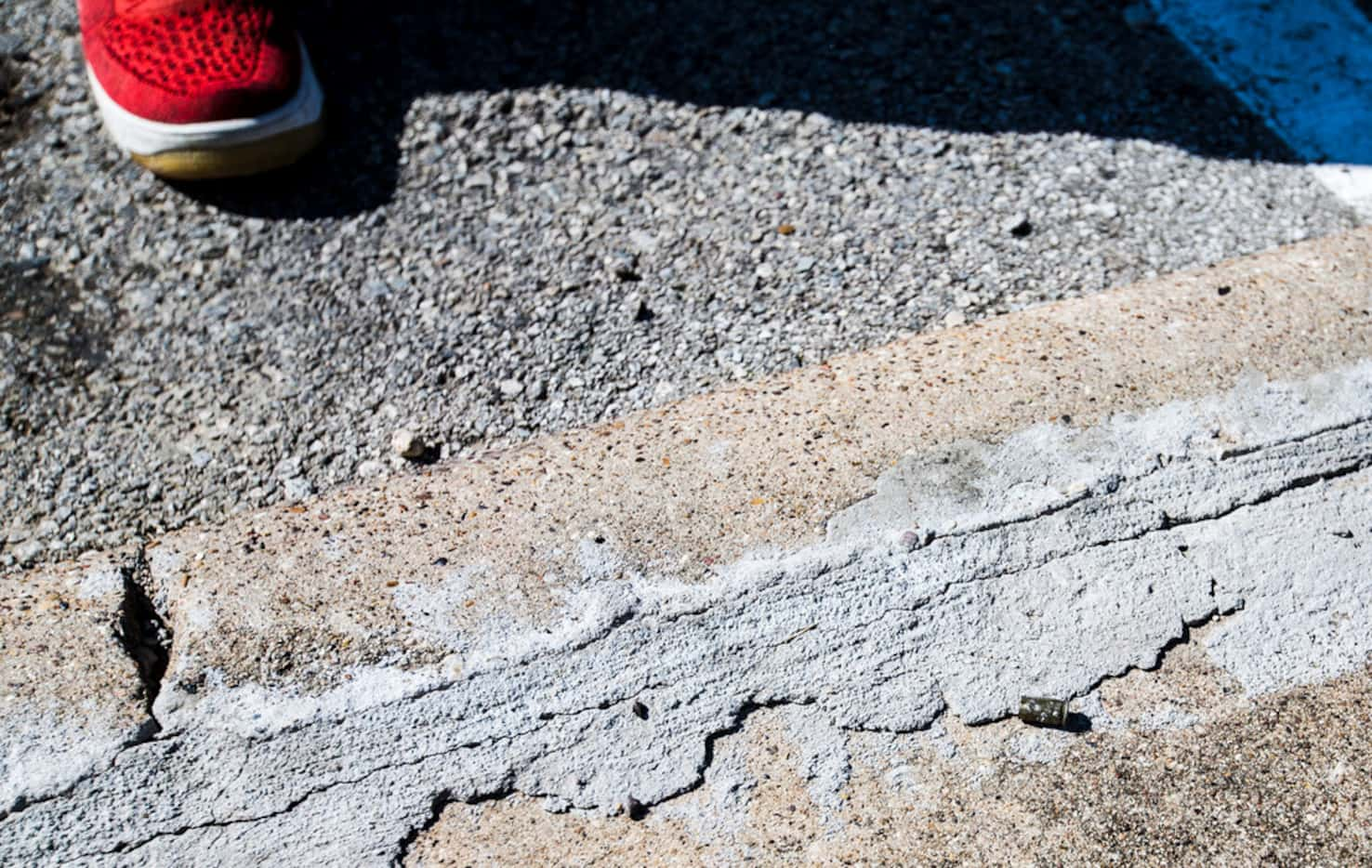 A bullet casing lay on the ground at the Ridgecrest Terrace Apartments in Dallas on Thursday.