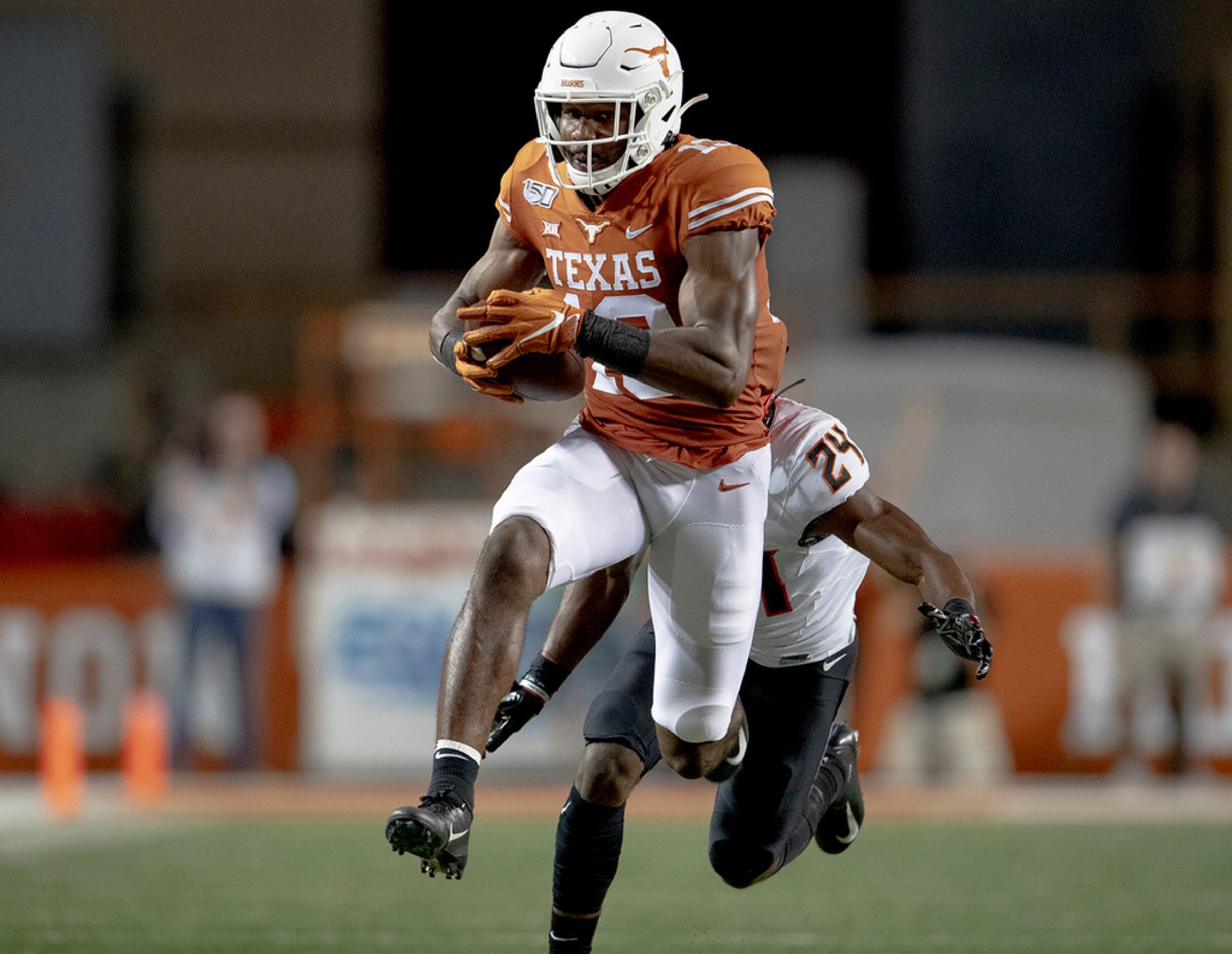 Texas wide receiver Brennan Eagles (13) runs for a touchdown covering 73 yards after...