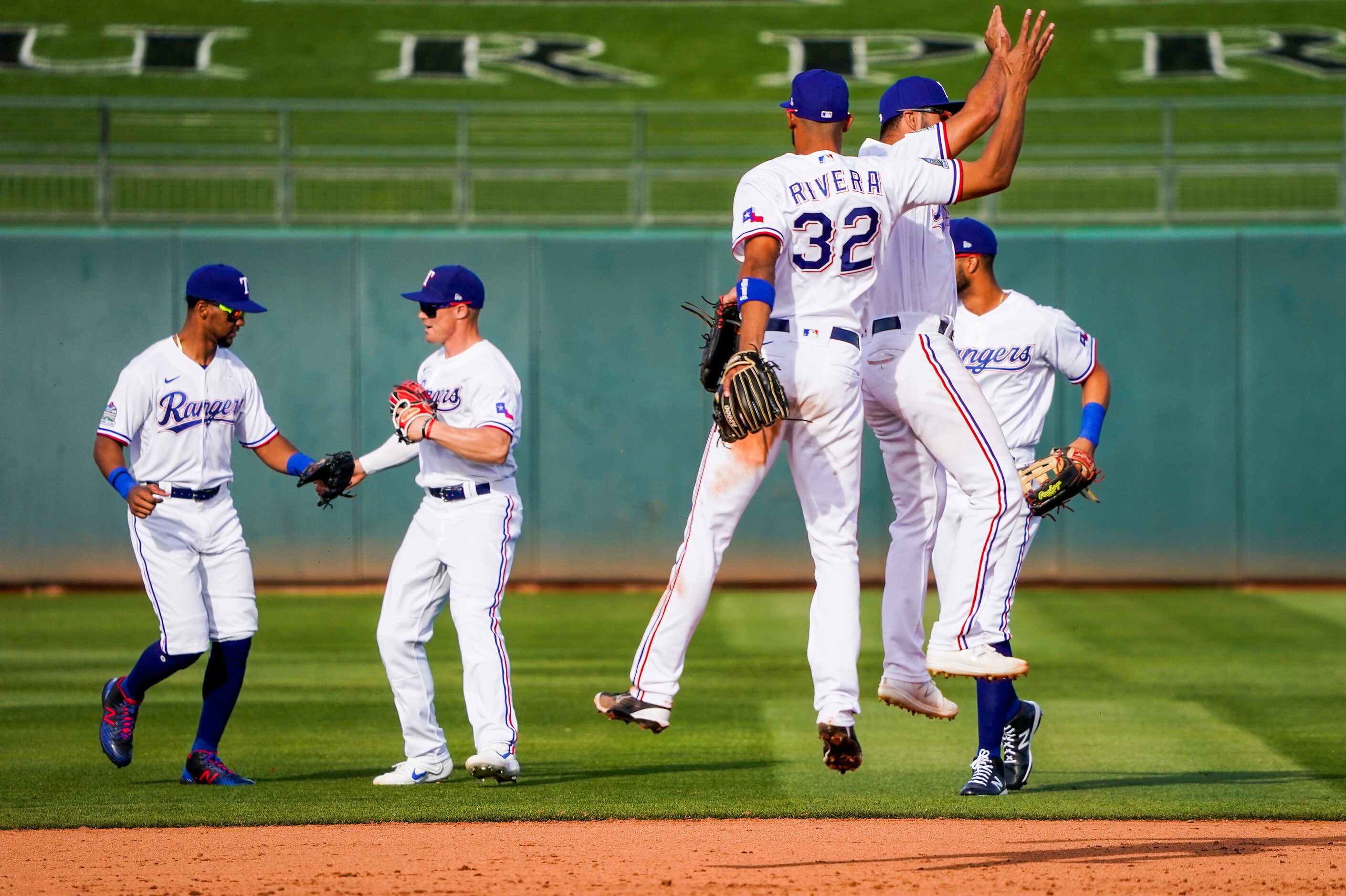 Texas Rangers players, from left, outfielder Leody Taveras, outfielder Scott Heineman,...