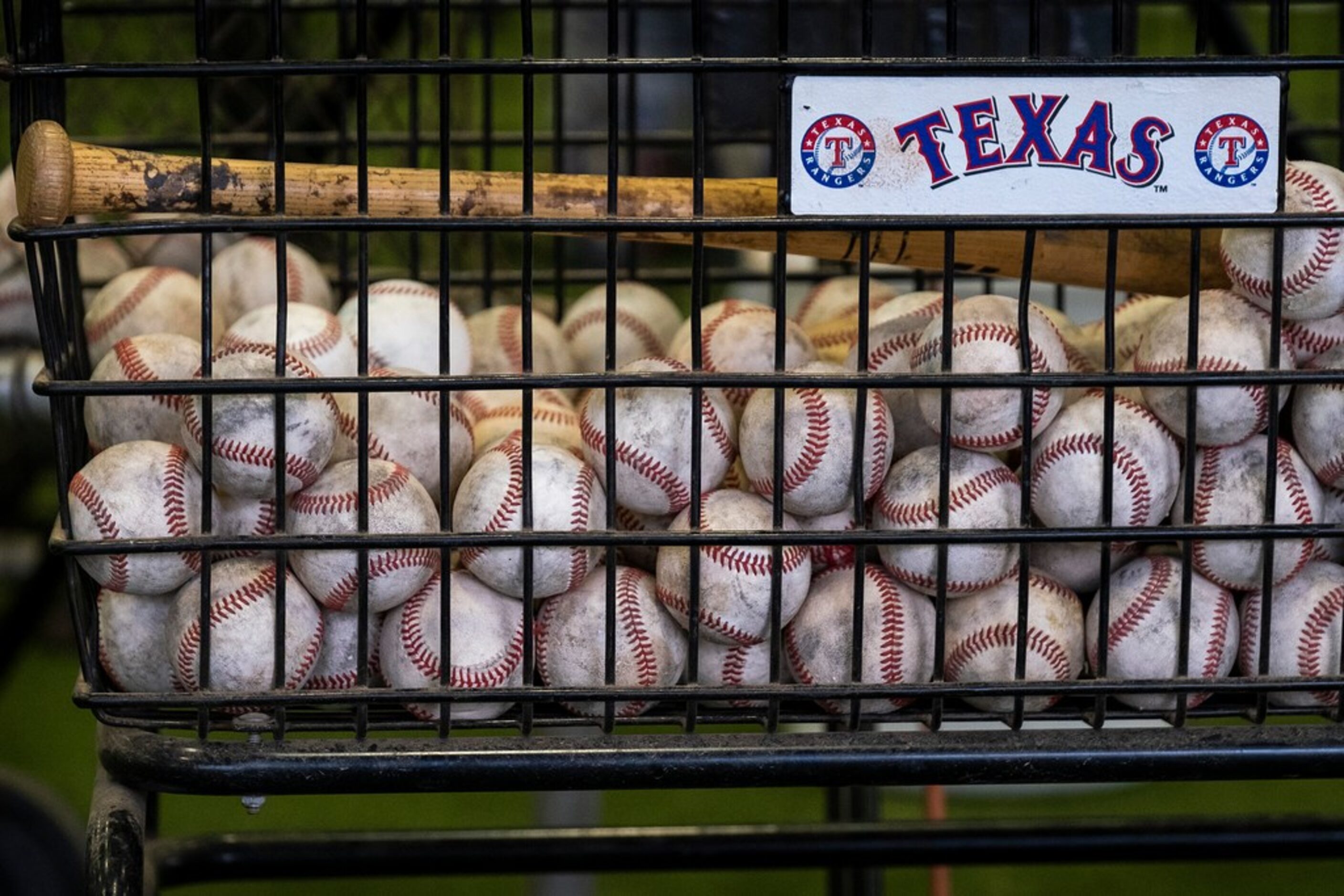 A basket of balls in the batting cages during a spring training workout at the team's...