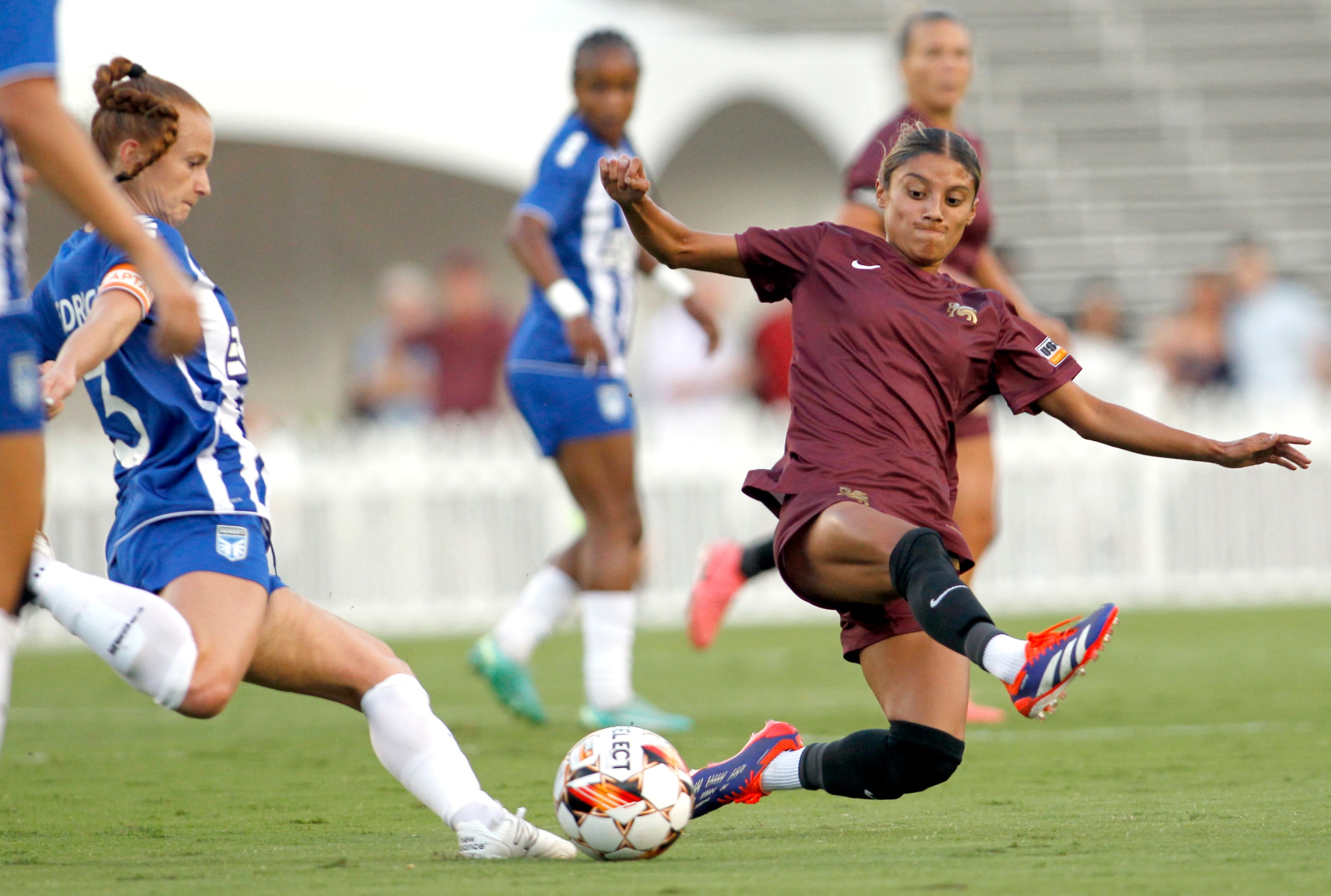 Dallas Trinity FC's Samantha Meza (15), right, makes a flying attempt at a block of DC Power...