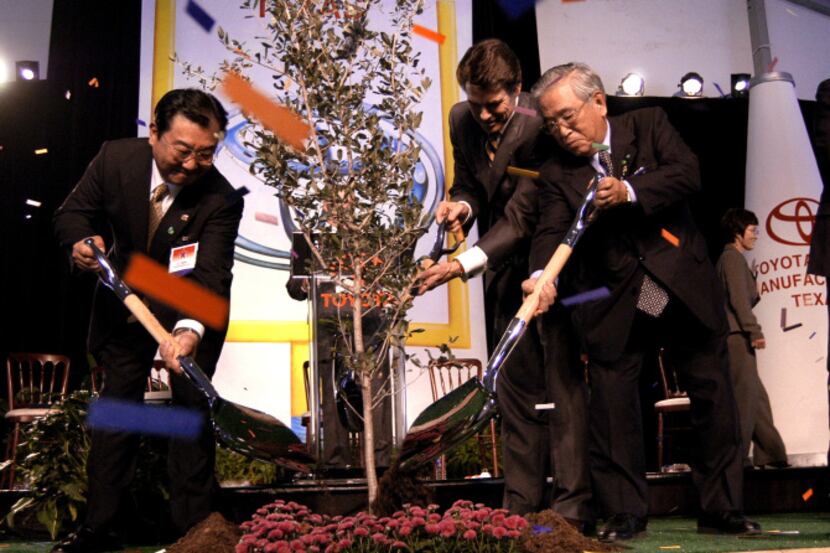 Hidehiko Tajima (left), president of Toyota Manufacturing, Texas; Gov. Rick Perry; and...
