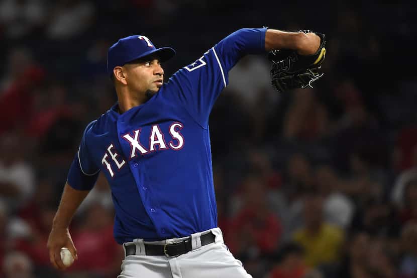 ANAHEIM, CA - AUGUST 22:  Tyson Ross #44 of the Texas Rangers pitches against the Los...