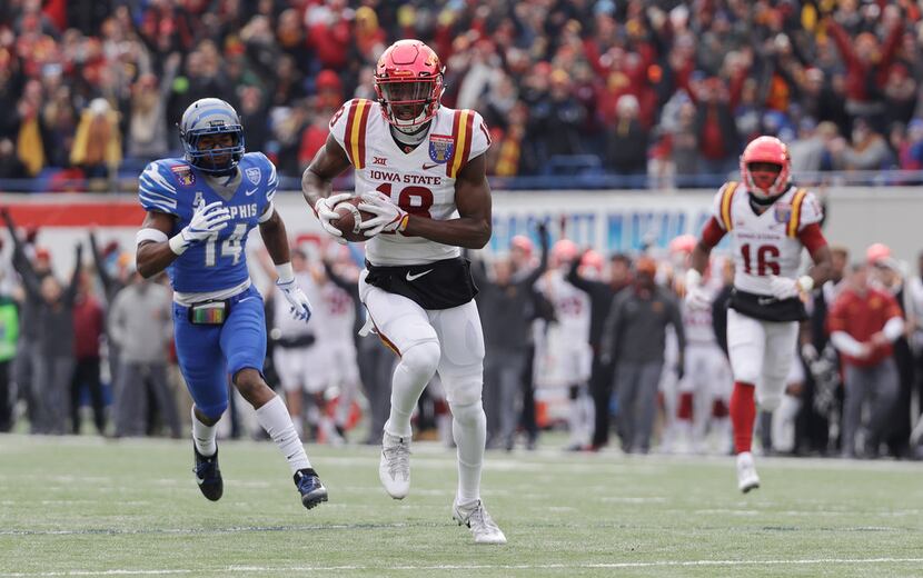 Iowa State wide receiver Hakeem Butler (18) runs for a touchdown ahead of Memphis defensive...