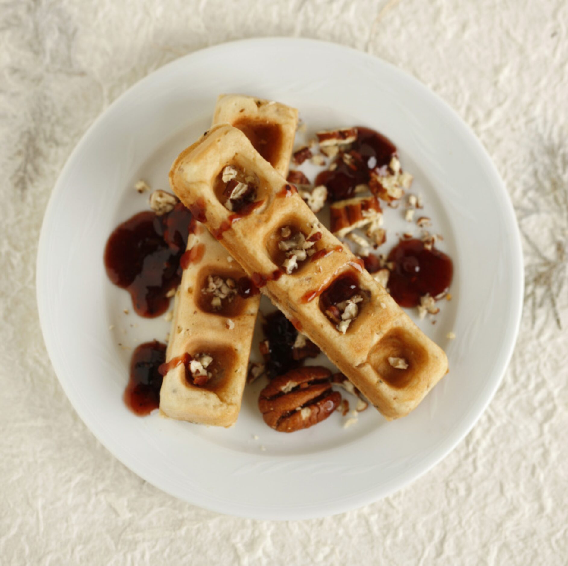 CHICKEN AND WAFFLES: Fold diced chicken and a seasoning blend into your waffle mix. Paint...