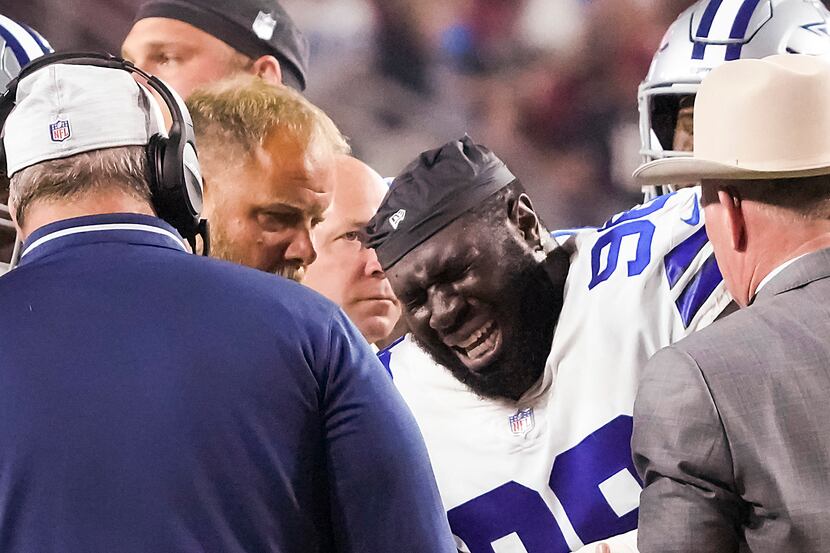Dallas Cowboys defensive tackle Neville Gallimore (96) receives medical attention after...