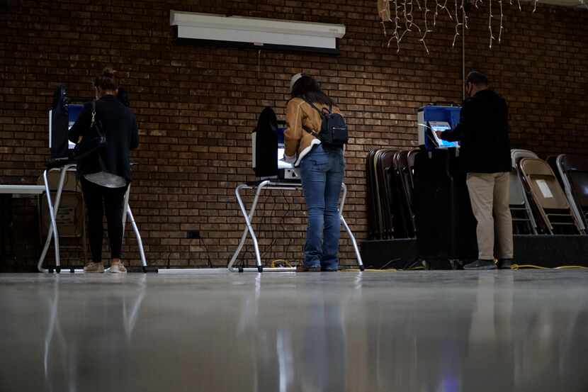 Voters cast their ballots at the Knights of Columbus building on the north side of Fort...