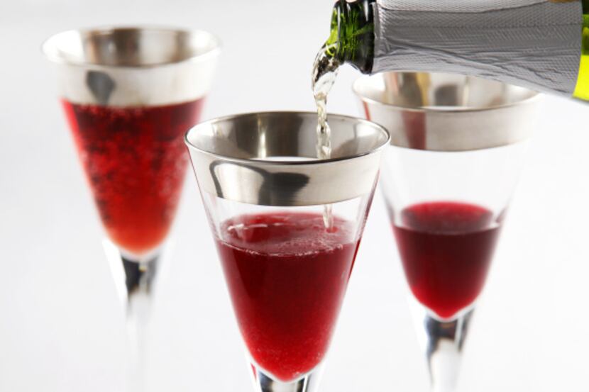 Let the good cheer flow with pomegranate juice mixed with sparking apple cider, served in...