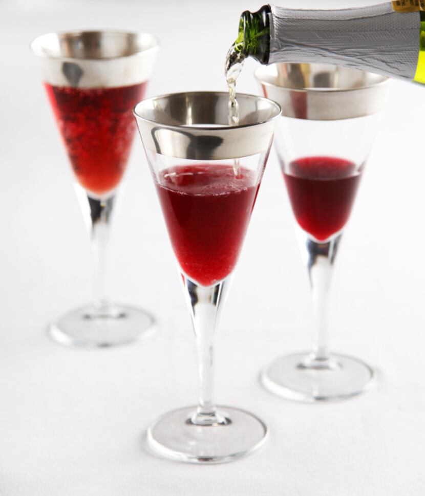 Let the good cheer flow with pomegranate juice mixed with sparking apple cider, served in...