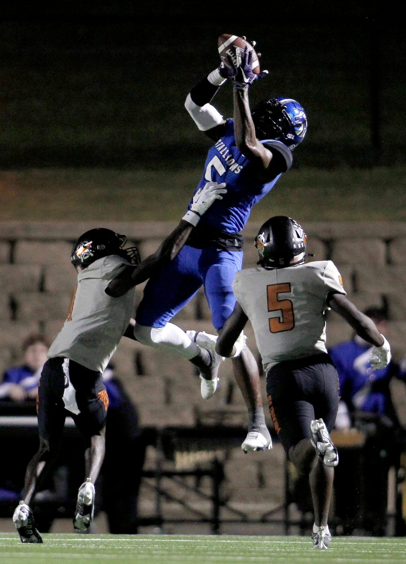 North Mesquite receiver Cordale Russell (5) leaps to pull in a long pass in the waning...