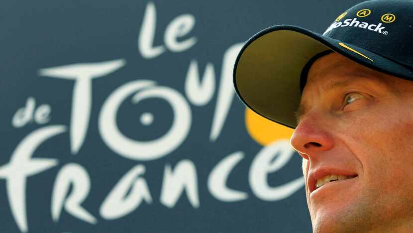 Seven-time Tour de France champion Lance Armstrong looking back on the podium after the 20th...