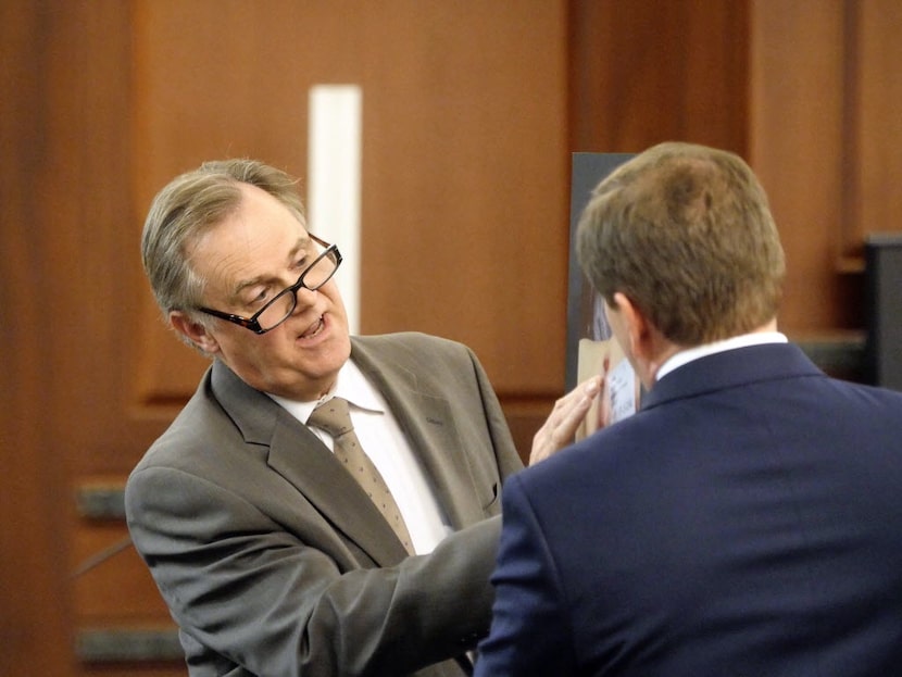 Dr. Jeffrey Barnard (left) described gunshot entry wounds on the body of Kaufman County...