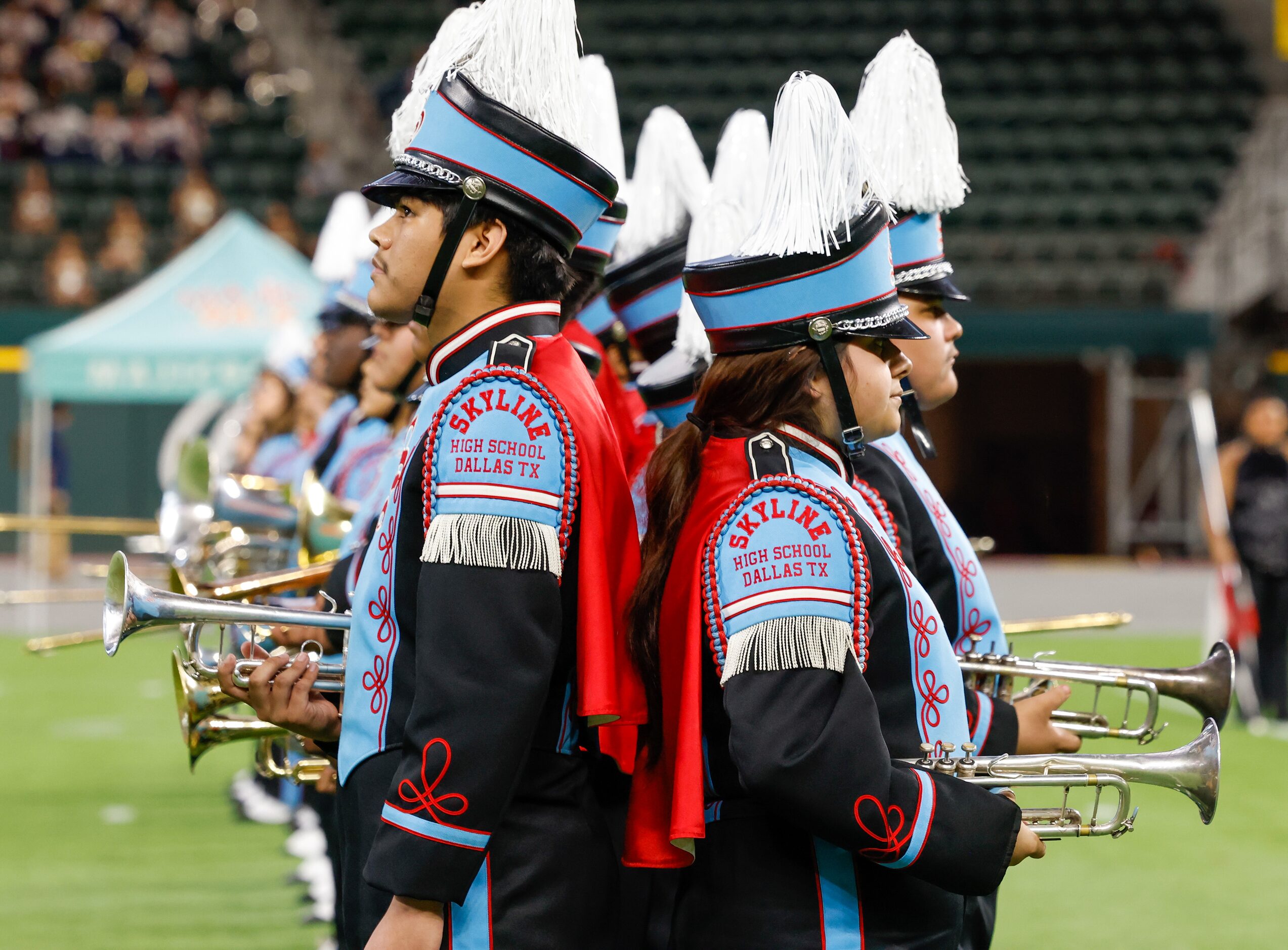 Members of Skyline High School’s marching band prepare to perform at the Roland Parrish...