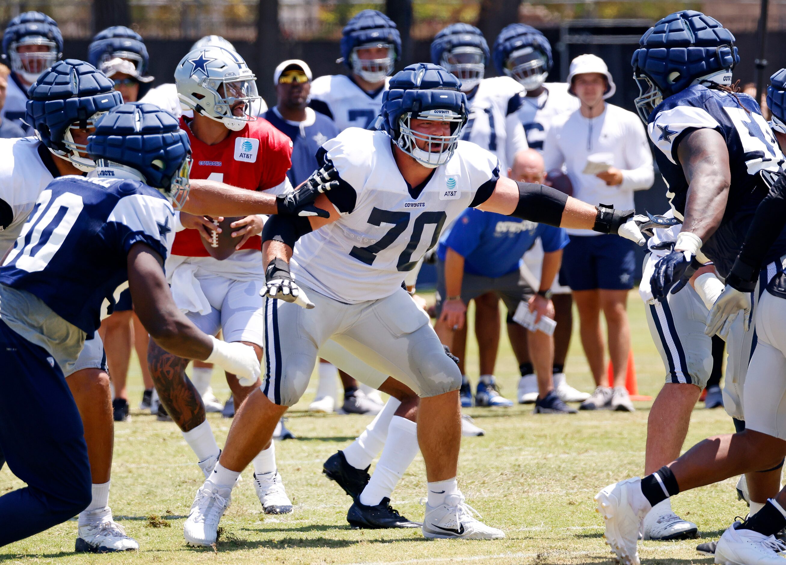 Dallas Cowboys guard Zack Martin (70) provides blocking up front for Dak Prescott during a...