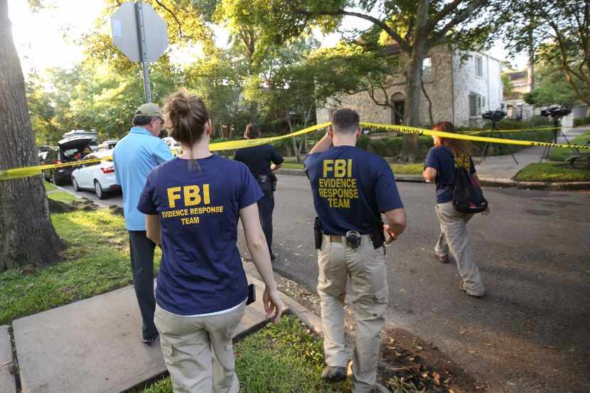FBI, Bureau of Alcohol, Tobacco, Firearms and Explosives (ATF), and Houston Police work at...