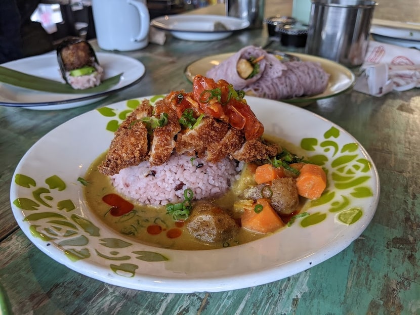 Yellow curry with a panko-fried chicken thigh on top at Khao Noodle Shop.