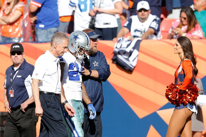 Dallas Cowboys cornerback Nolan Carroll (24) is helped off the field after injuring himself...