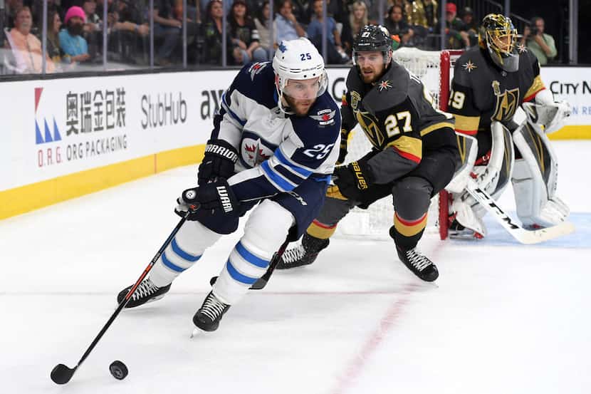 LAS VEGAS, NV - MAY 18: Paul Stastny #25 of the Winnipeg Jets is pursued by Shea Theodore...