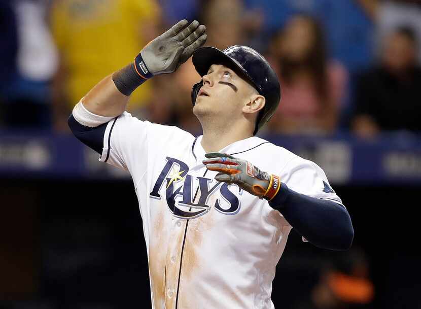 Tampa Bay Rays' Logan Morrison celebrates after his home run off Baltimore Orioles pitcher...