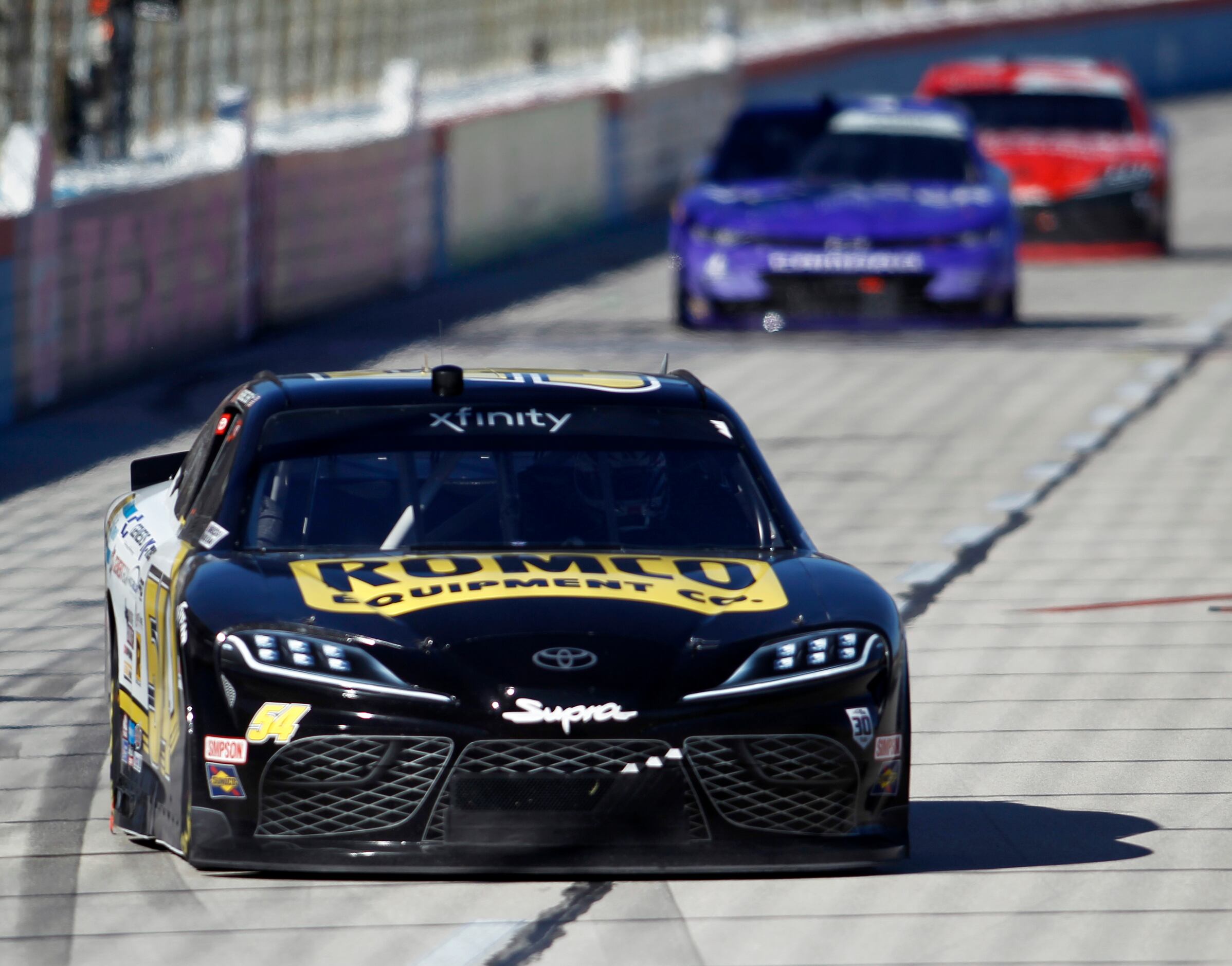 John Hunter Nemechek holds the lead over the field in his #54 car enroute to his checkered...