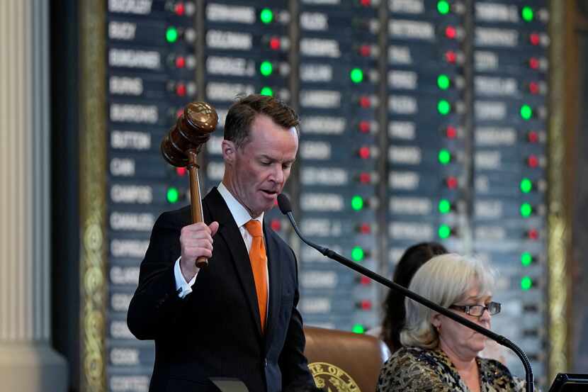 Texas Speaker of the House Dade Phelan oversees debate over a voting bill in the House...