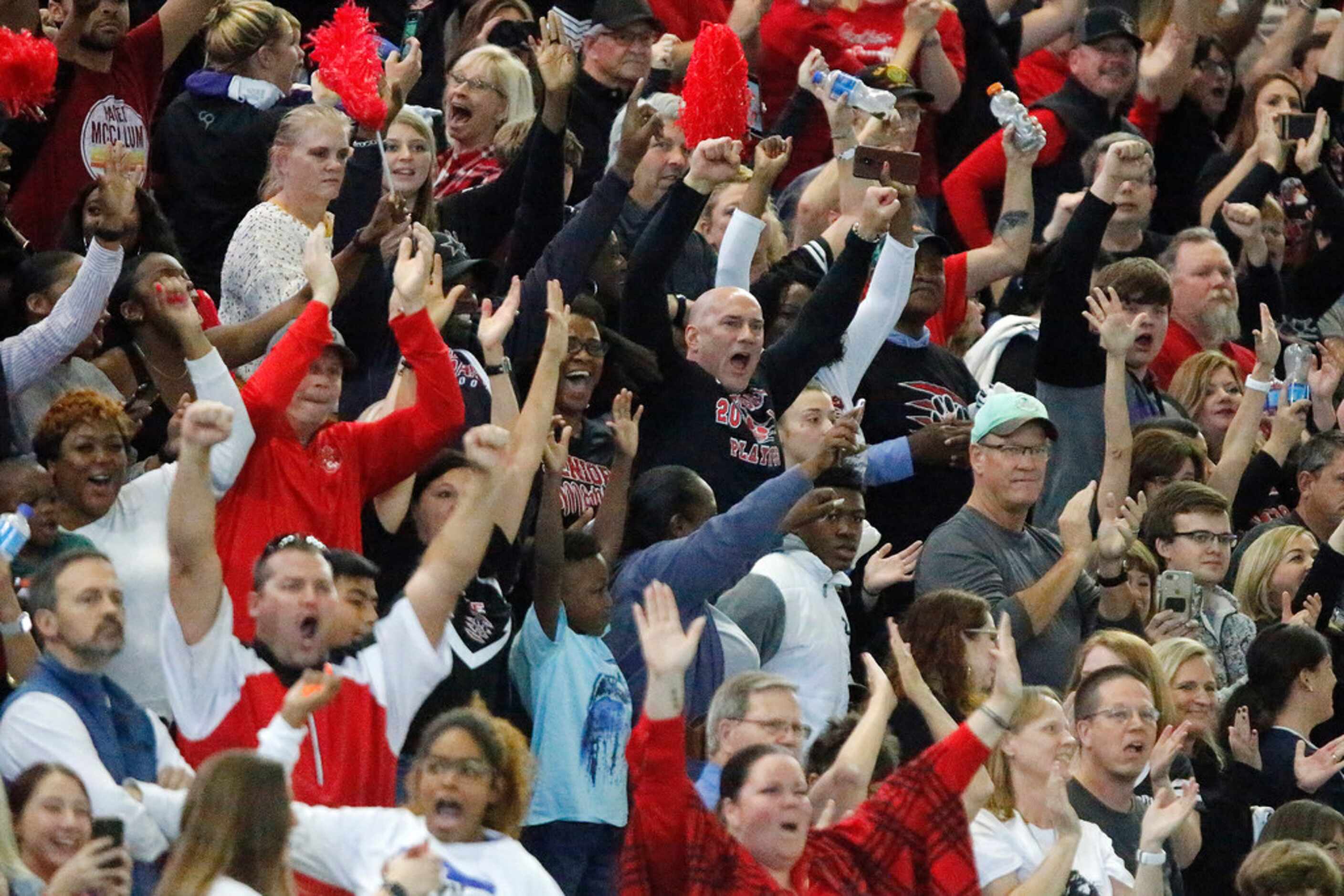 Colleyville Heritage fans react to an interception with four seconds left in the game, to...