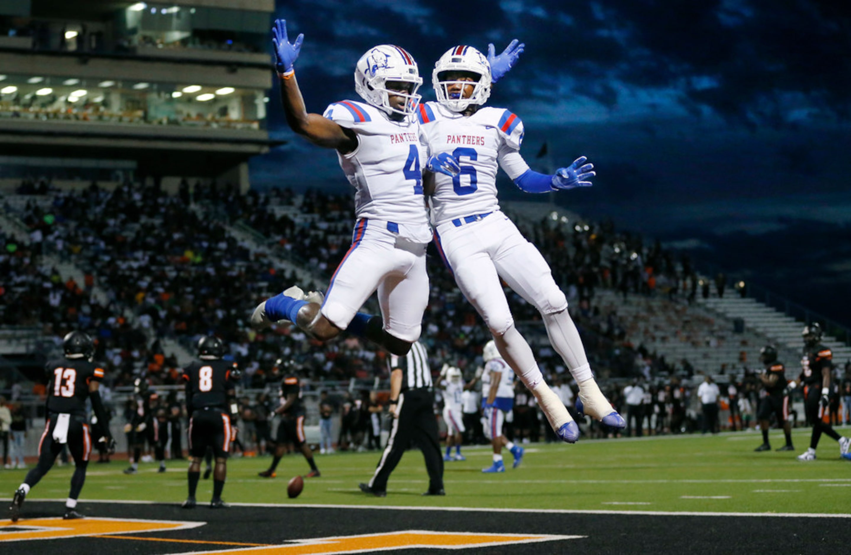 Duncanville wide receiver Zeriah Beason (4) is congratulated by his teammate Marquelan...