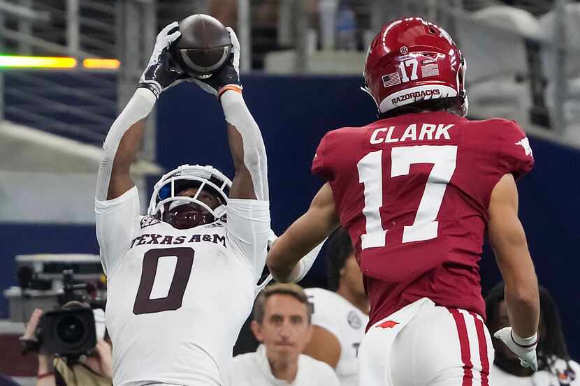 Texas A&M wide receiver Ainias Smith (0) makes a catch as Arkansas defensive back Hudson...