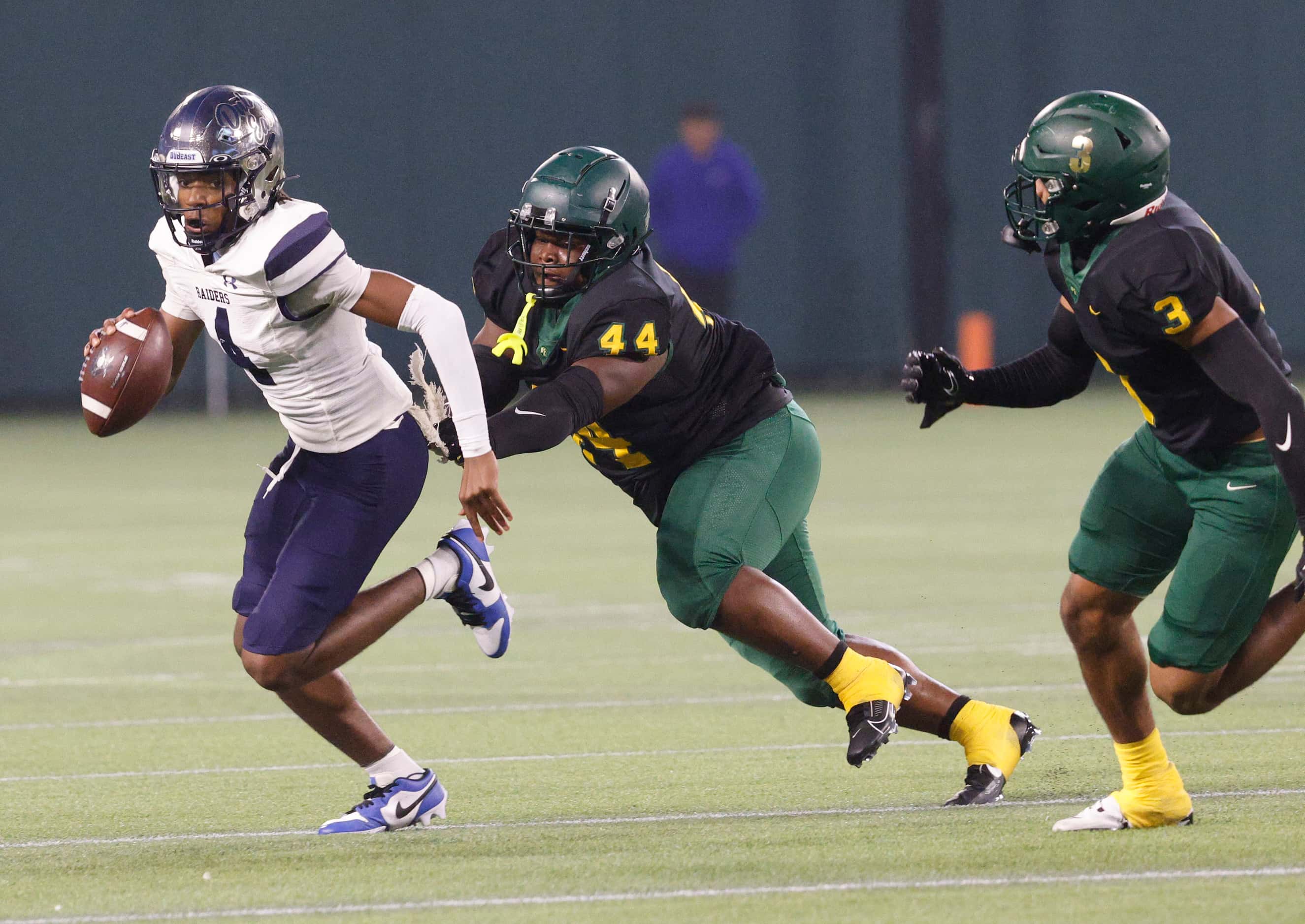 Wylie East's  quarterback Howard Fisher (4) carries the ball as DeSoto's Marshall Kirven...