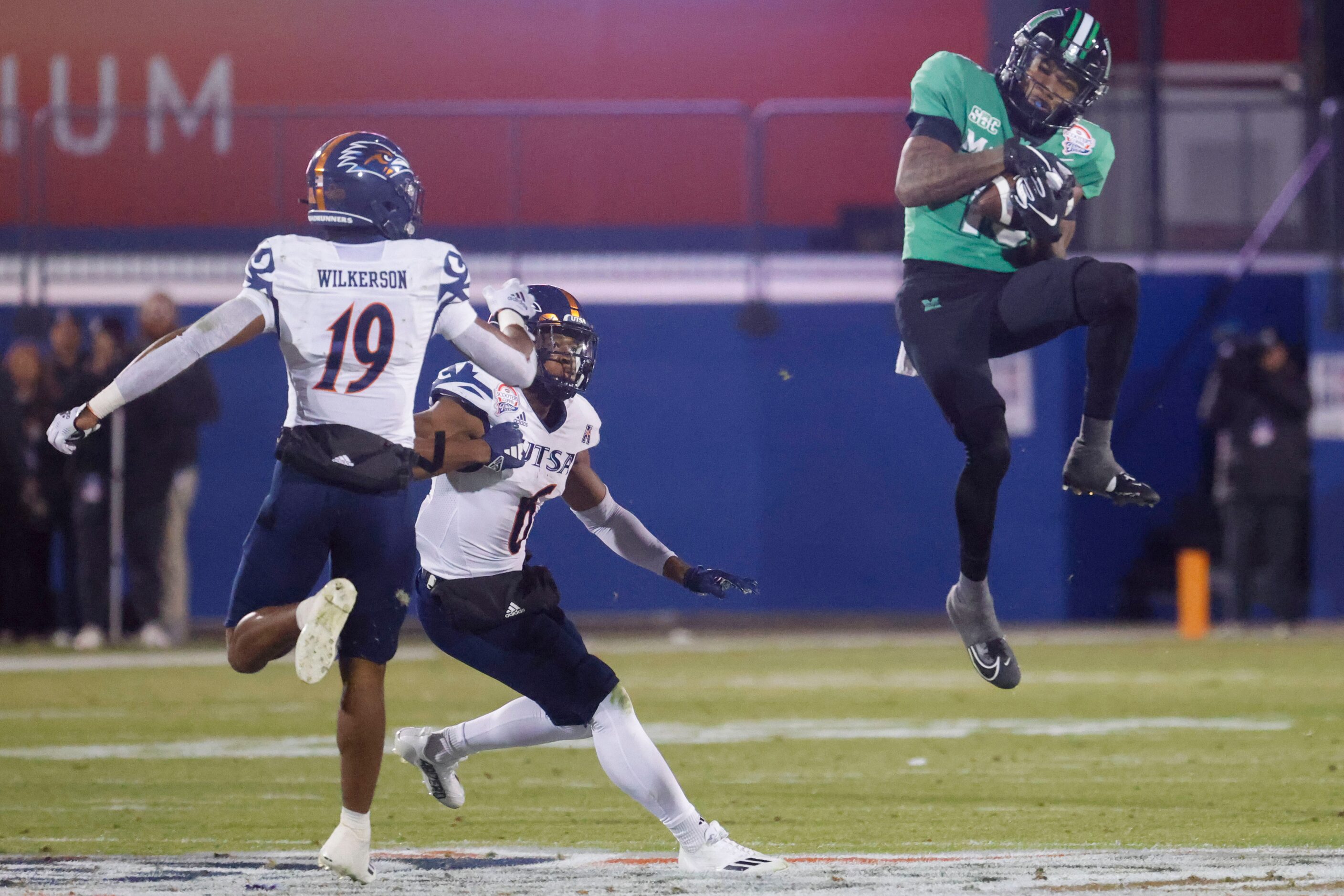 UTSA safety Marcellus Wilkerson (left), safety Kelechi Nwachuku (center) watch as Marshall...