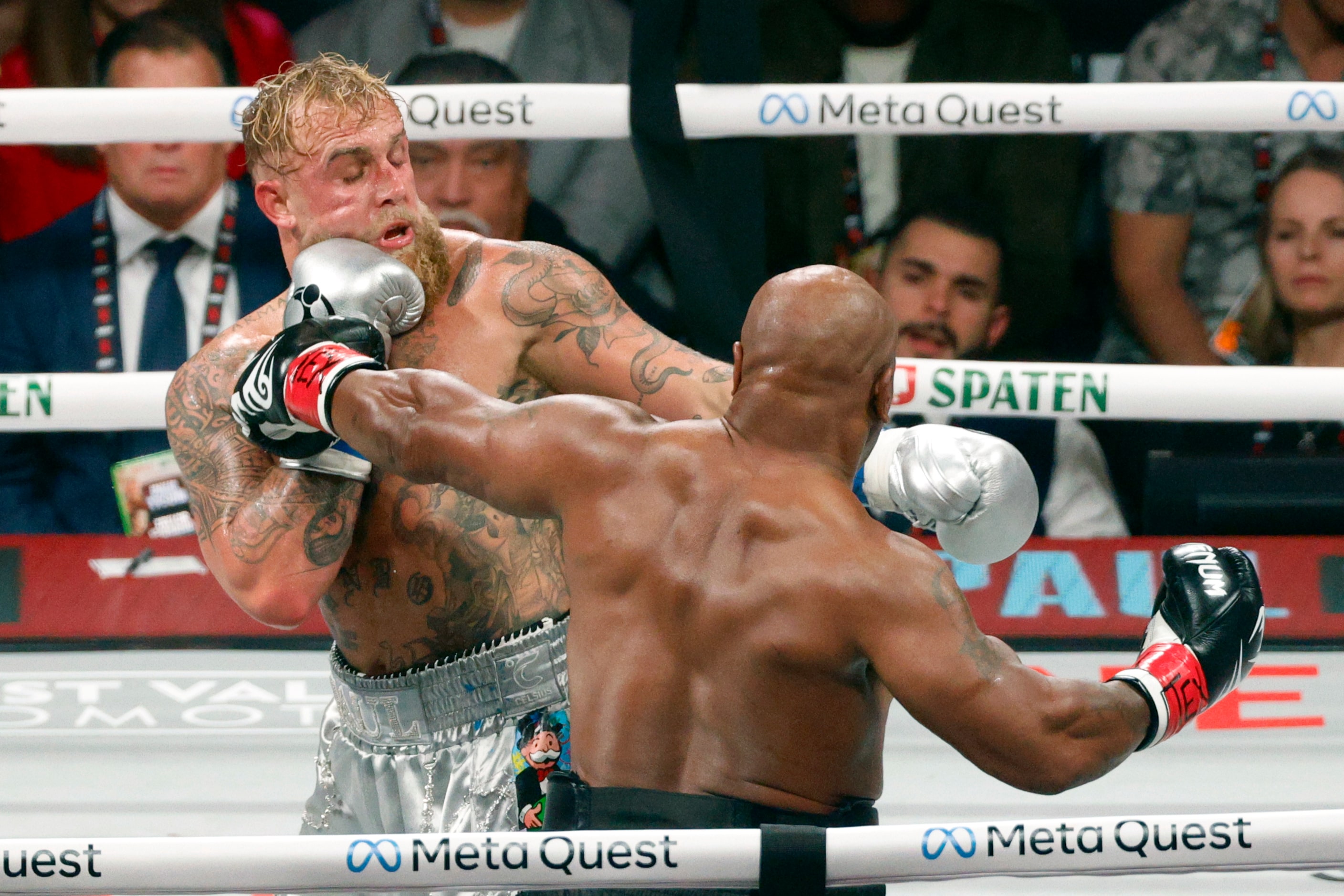 Mike Tyson and Jake Paul trade punches during a heavyweight boxing match, Friday, Nov. 15,...