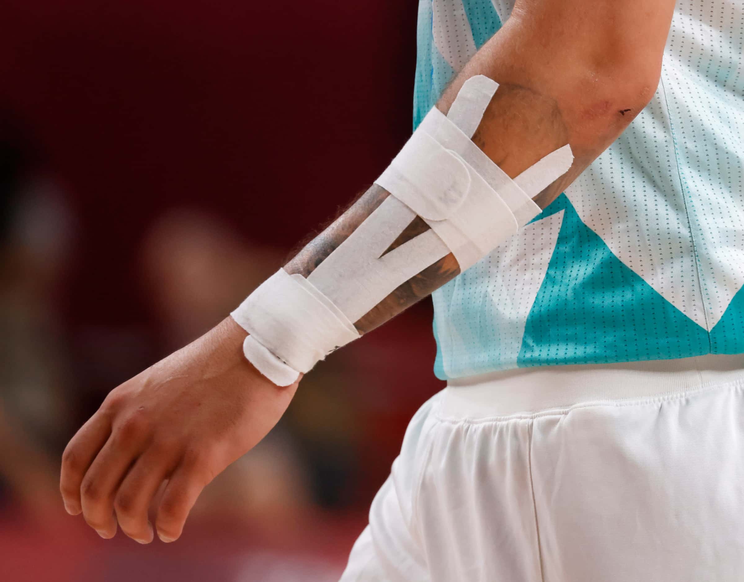 Slovenia’s Luka Doncic (77) plays with a taped forearm against Australia in the bronze medal...