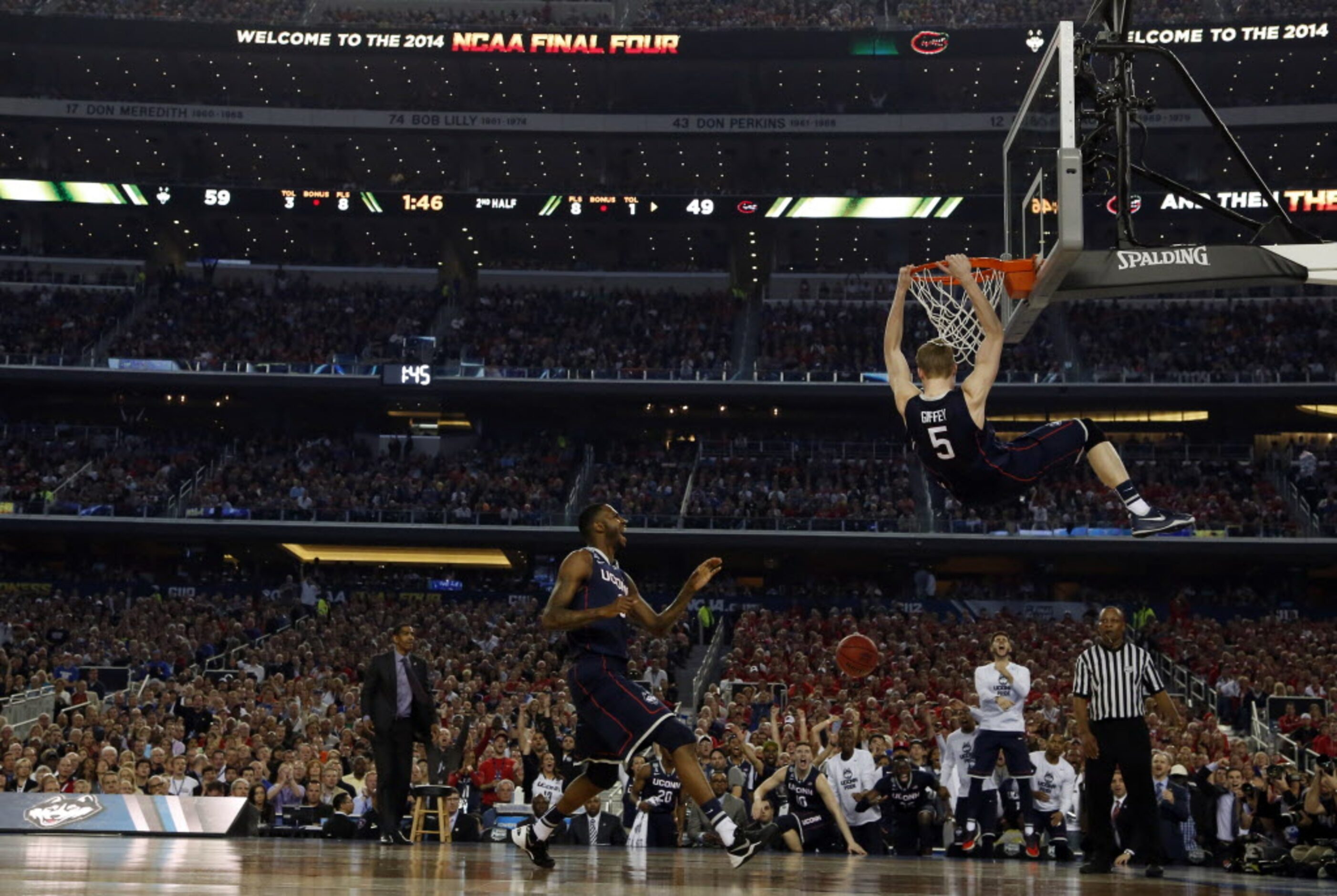 Connecticut Huskies guard/forward Niels Giffey (5) dunks the ball as Connecticut Huskies...