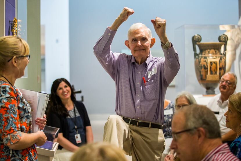 Dick Bernet makes a pole vaulting motion during a presentation on the Olympics and ancient...