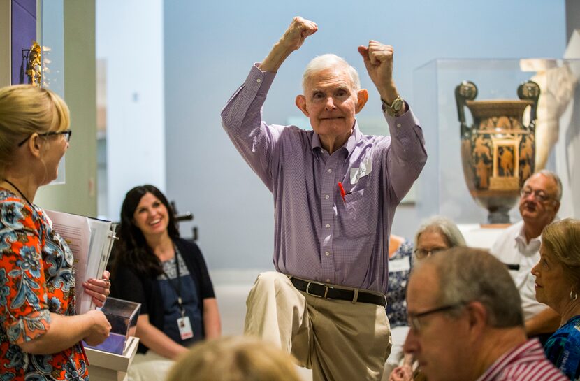 Dick Bernet makes a pole vaulting motion during a presentation on the Olympics and ancient...