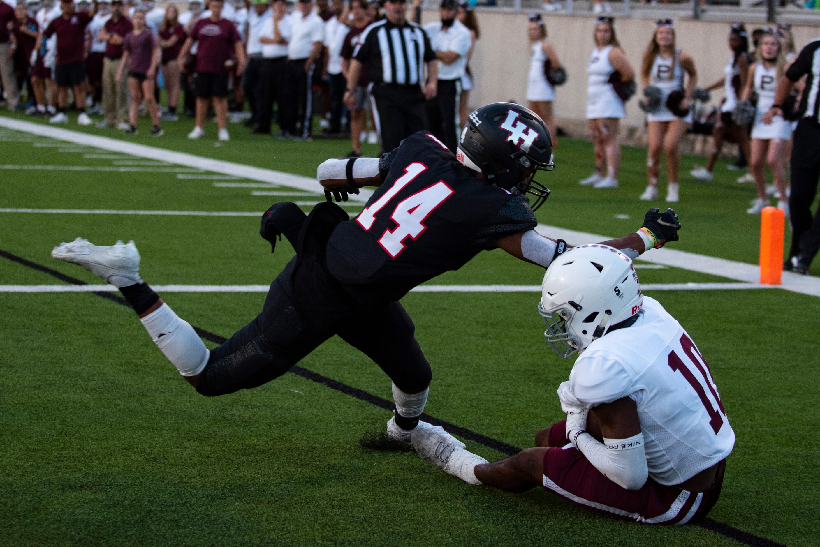 Plano Senior High School senior Myles Bourne-Nelson (10) catches a ball in the end zone to...