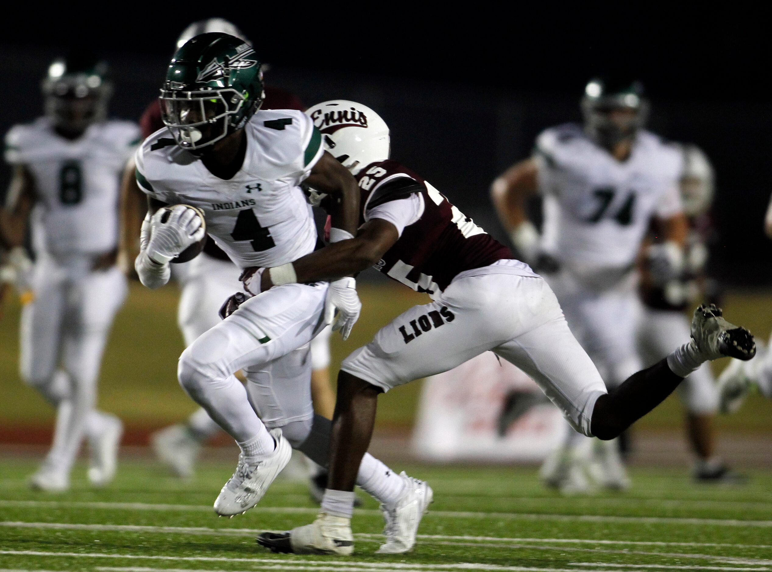 Waxahachie receiver Jayden Watson (4) tacks on yardage after the catch before being tackled...