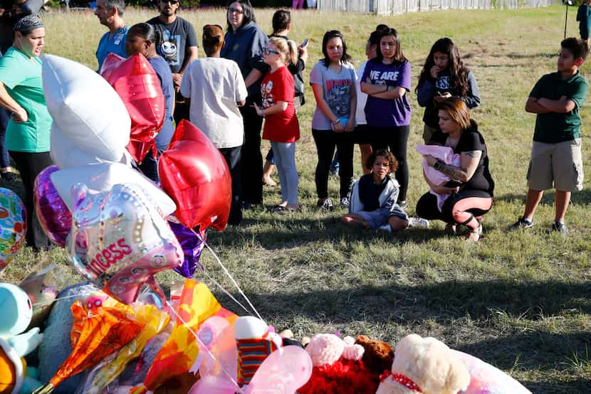 People gather near where Sherin Mathews was found Sunday morning in Richardson.