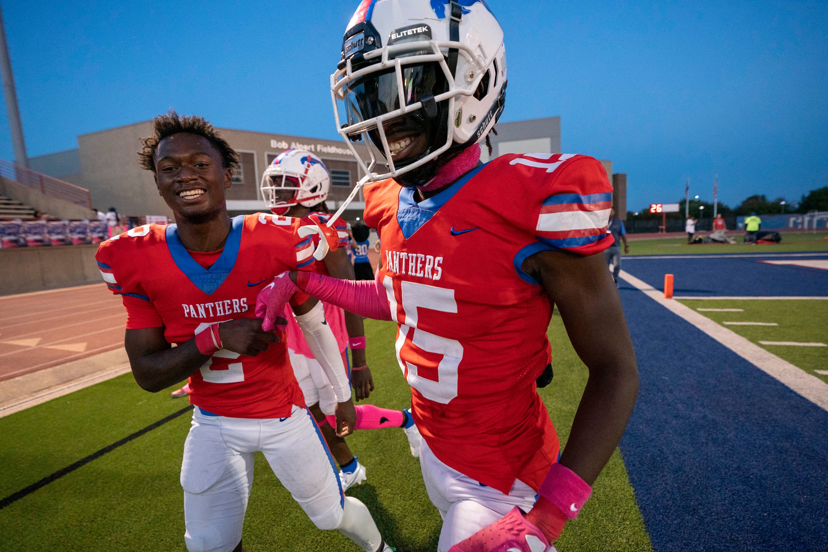 Duncanville senior defensive back Lamoderick Spencer (15) is congratulated on the sidelines...