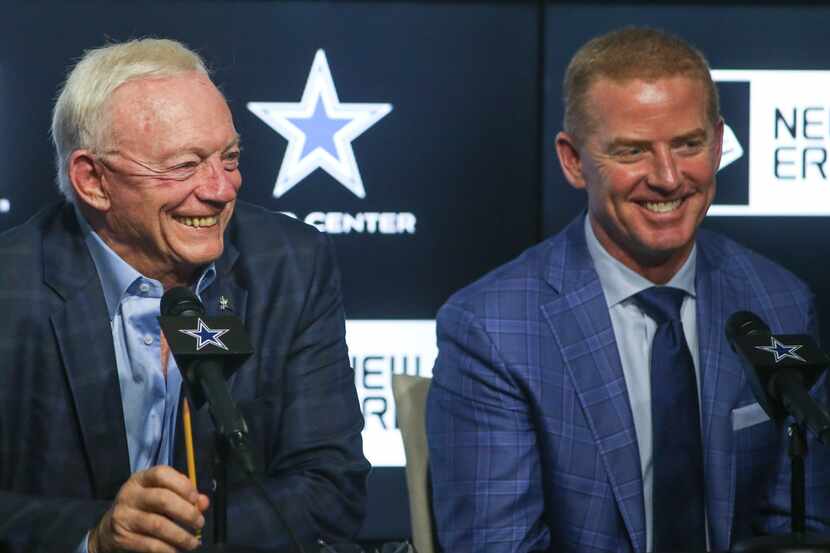 Dallas Cowboys owner Jerry Jones, left, and head coach Jason Garrett laugh at a joke by...