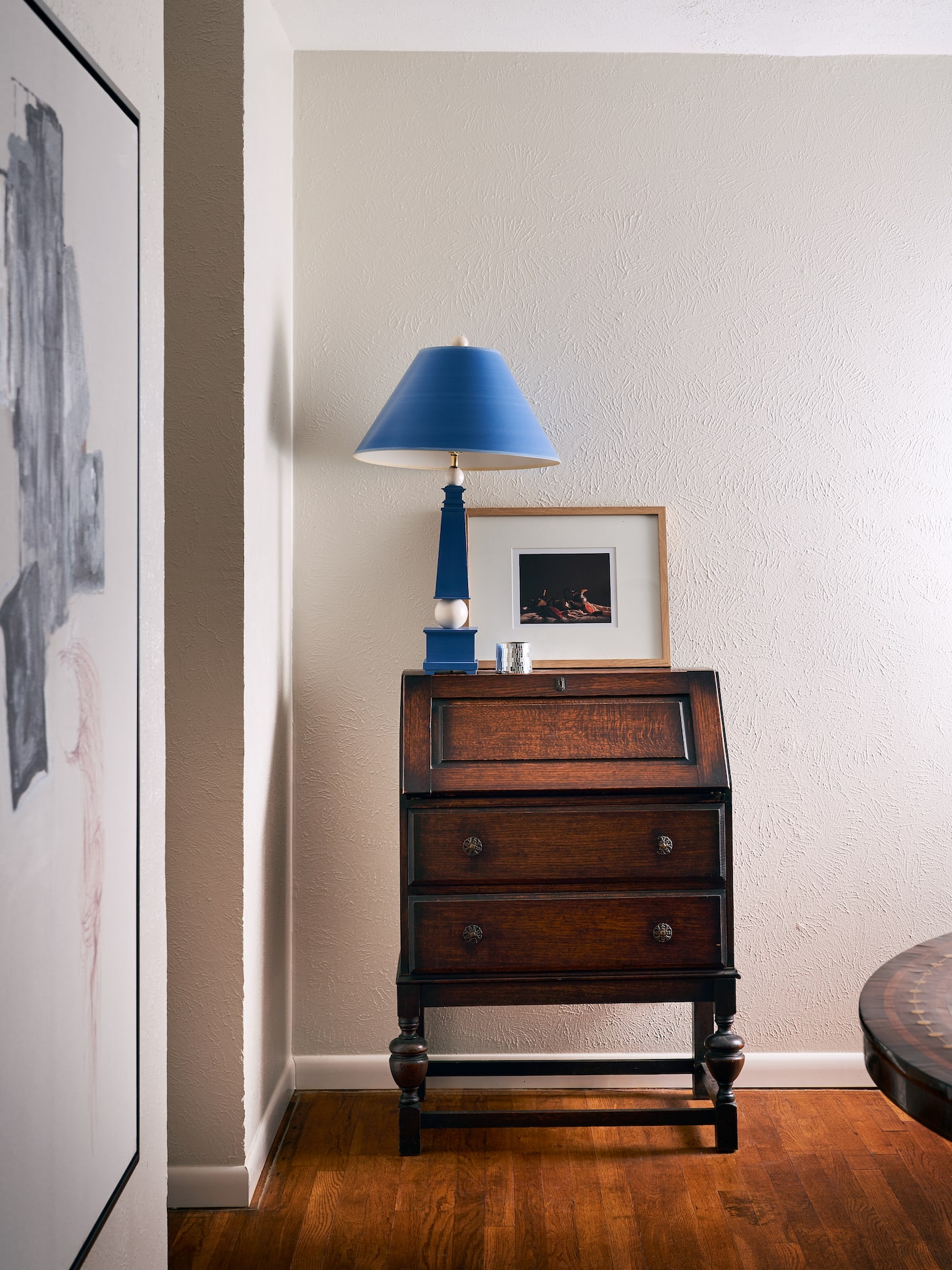 This small secretary desk came from a family friend, while the lamp was sourced from the...