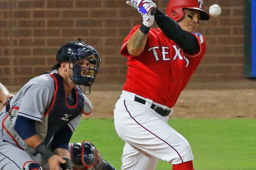 Texas Rangers right fielder Shin-Soo Choo (17) fouls off a pitch during the Cleveland...