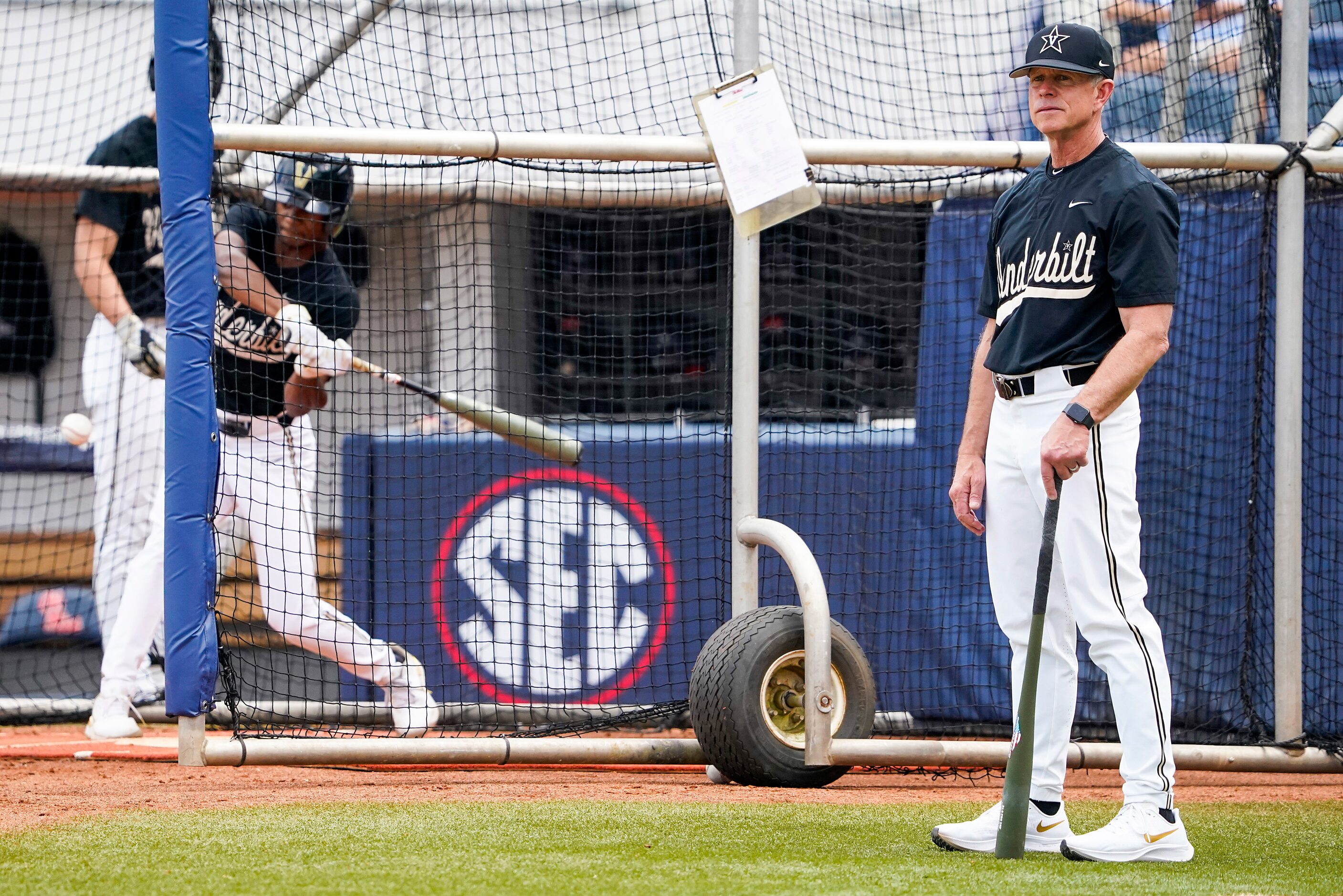 Vanderbilt head coach Tim Corbin watches his team take batting practice before an NCAA...