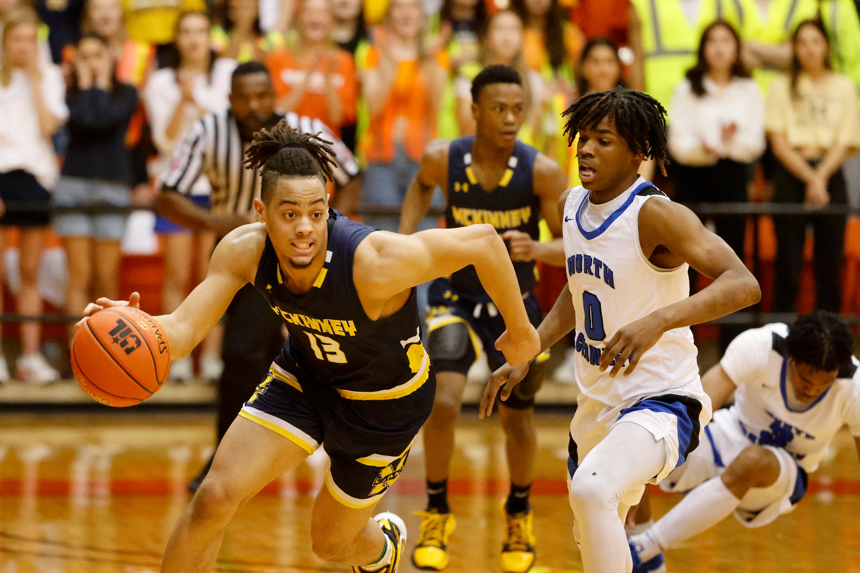 Mckinney’s Devin Vincent (13) drives the ball past North Crowley’s Terry Allen (0) during...