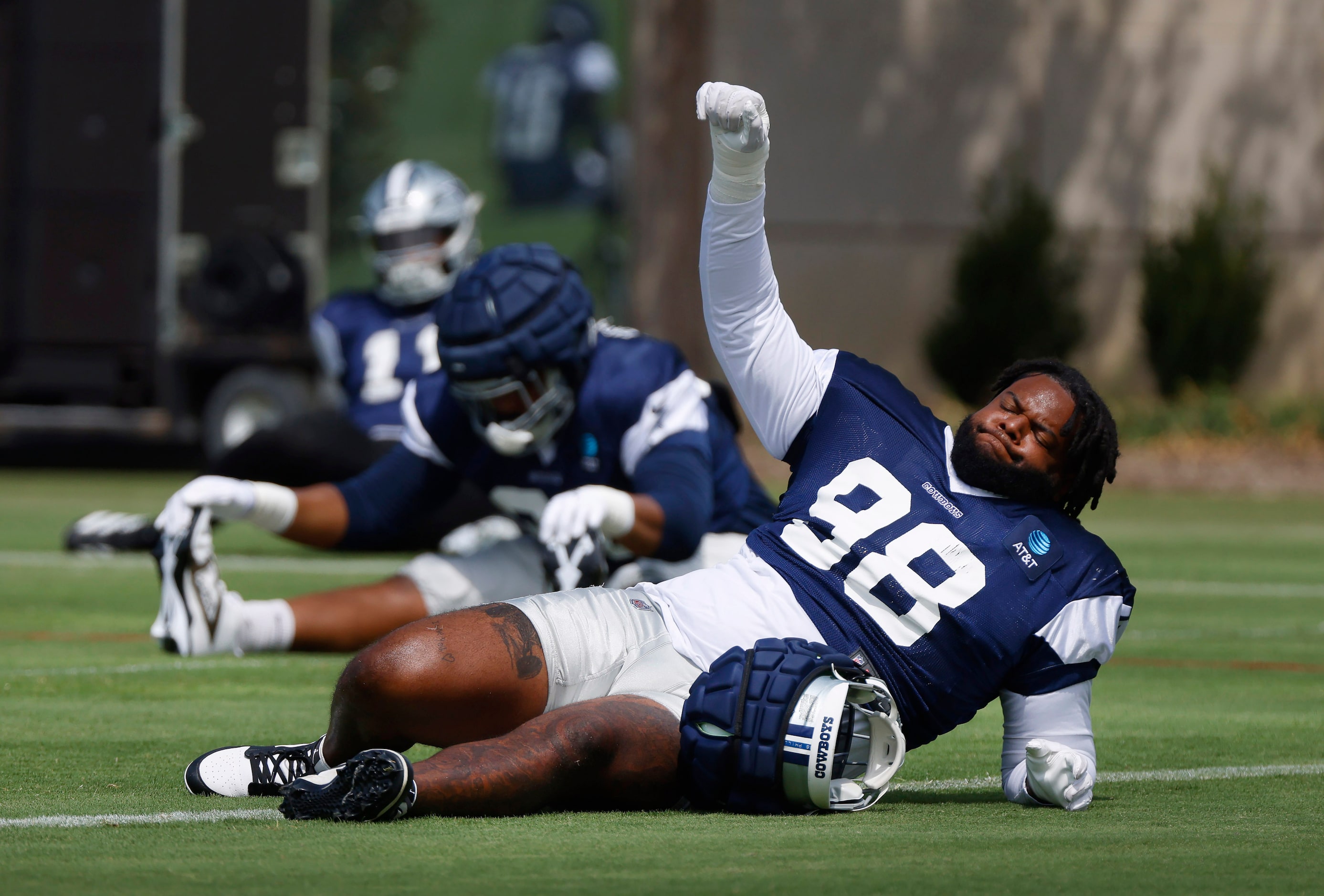 Dallas Cowboys defensive tackle Jordan Phillips (98) reacts to the music playing as the team...